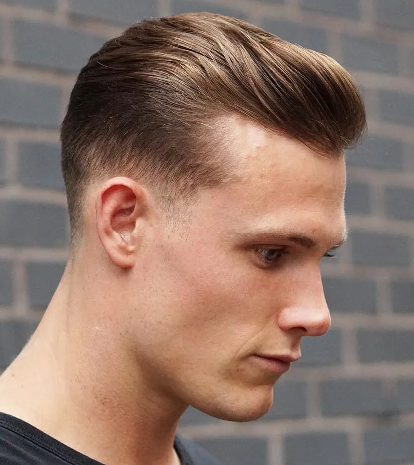 A man in black t-shirt showing the side view of his Classic Tapered Short Crop hairstyle A man in black t-shirt showing the side view of his Classic Tapered Short Crop hairstyle - latest hairstyle for men