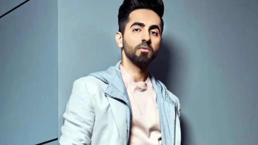 Ayushmann Khurrana in sky blue jacket with pink inner posing for camera Ayushmann Khurrana in sky blue jacket with pink inner posing for camera - Indian actors hairstyles