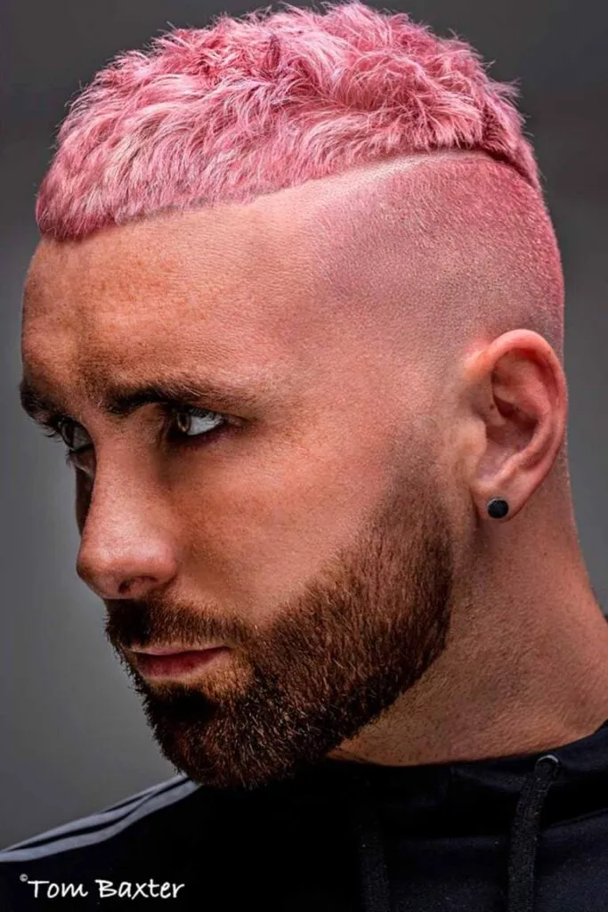 A man in black t-shirt with white strips showing his pink Textured High And Tight Haircut A man in black t-shirt with white strips showing his pink Textured High And Tight Haircut - men's haircut 2022