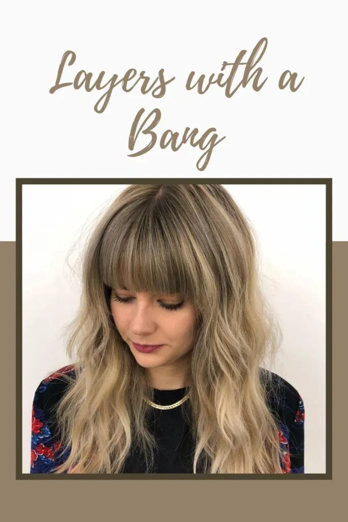 A girl in floral printed top showing the front view of her Layers with a bang hairstyle A girl in floral printed top showing the front view of her Layers with a bang hairstyle - hairstyle for girls long hair