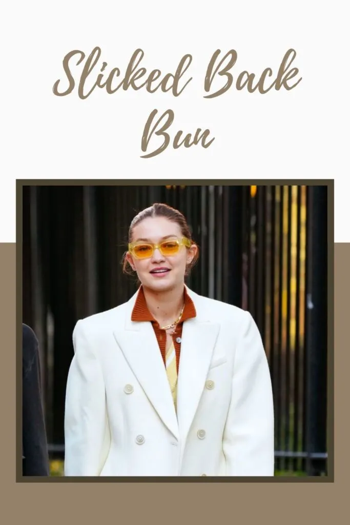A girl in white coat with brown inner and goggles showing her Slicked Back Bun A girl in white coat with brown inner and goggles showing her Slicked Back Bun - girl's hairstyle 2022
