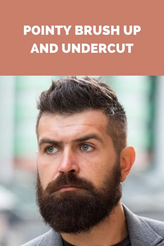 A man in grey coat with black inner posing for camera and showing his pointy brush up and undercut A man in grey coat with black inner posing for camera and showing his pointy brush up and undercut - hairstyles for men