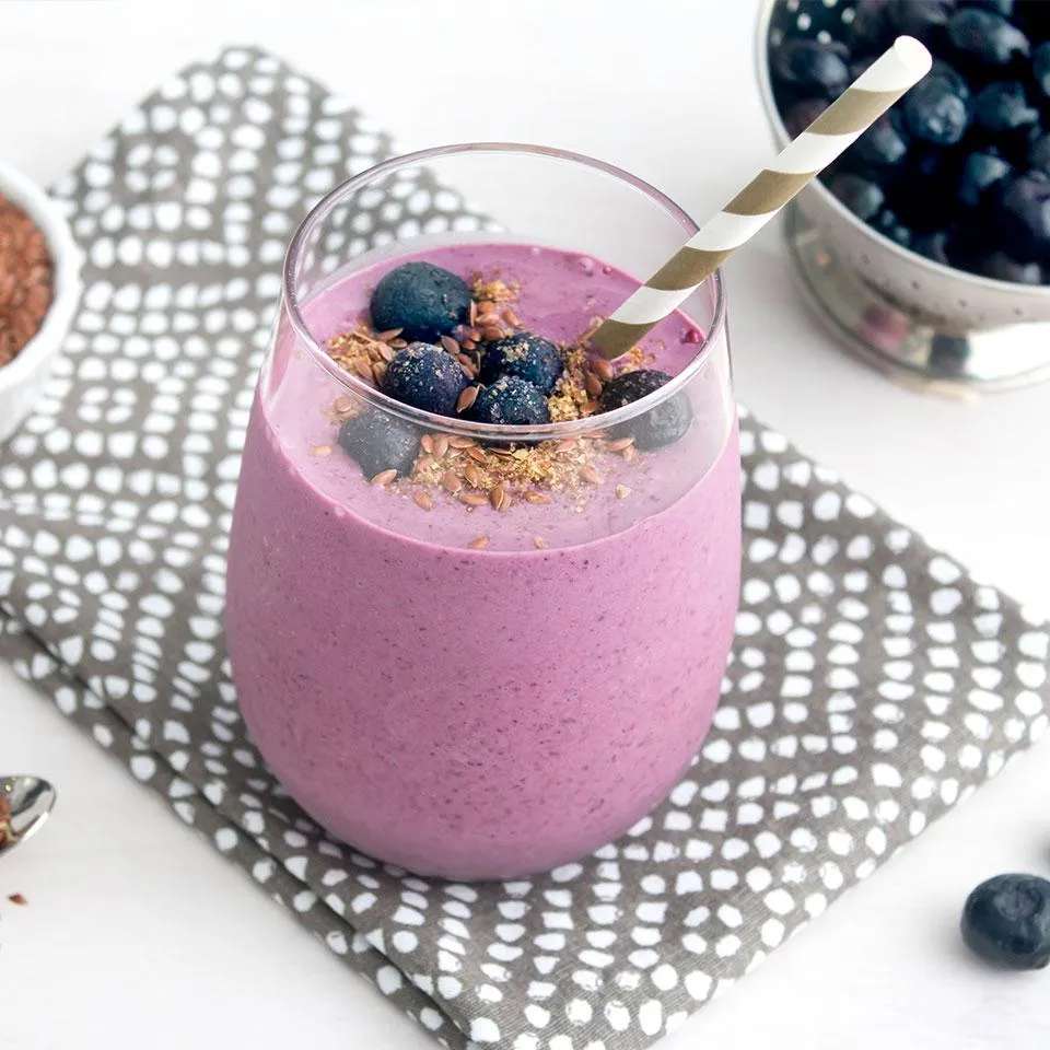 Chocolate, PB, and Berry Smoothie in glass with a straw - breakfast ideas for body building