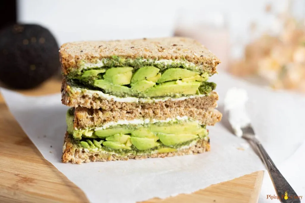 Avocado guacamole sandwich served in a white plate - breakfast for muscle gain and fat lose
