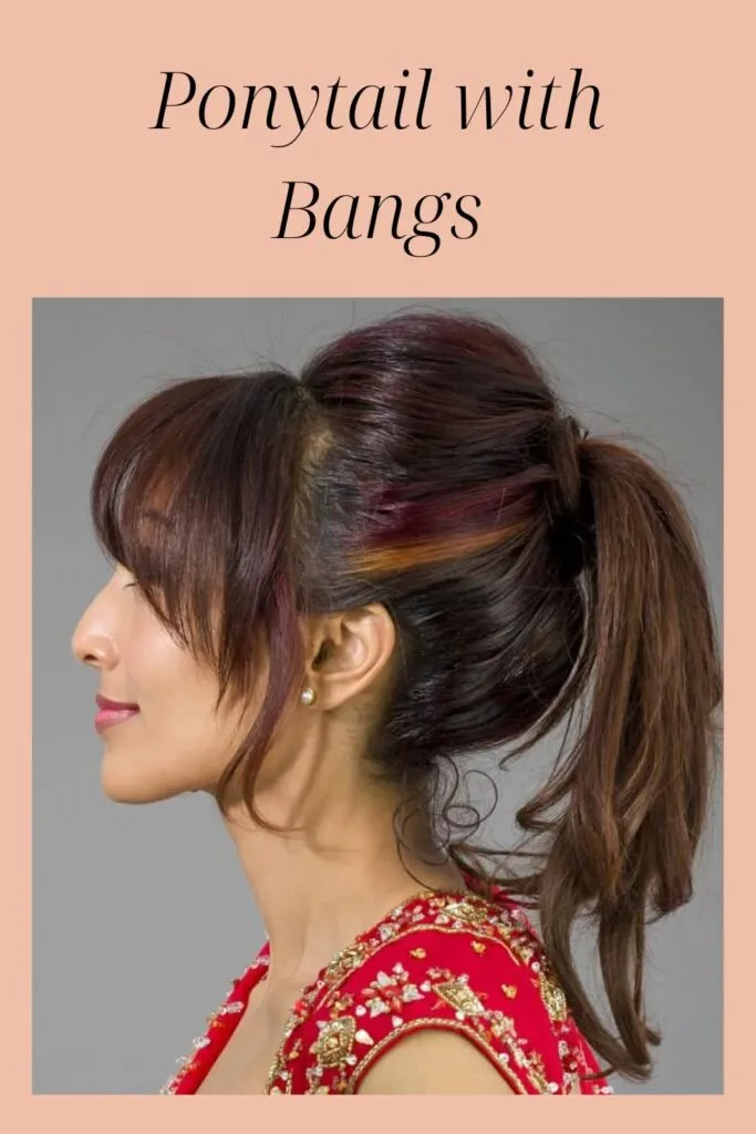 A girl in red outfit showing the side view of her Ponytail with Bangs hairstyle A girl in red outfit showing the side view of her Ponytail with Bangs hairstyle - 2022 hairstyles for Indian Women