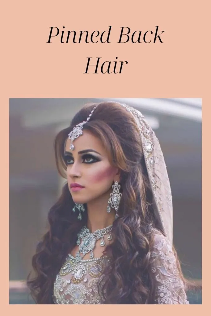 Women in off white lehenga with matching jewellery showing her pinned back hair Women in off white lehenga with matching jewellery showing her pinned back hair - Indian women hairstyles