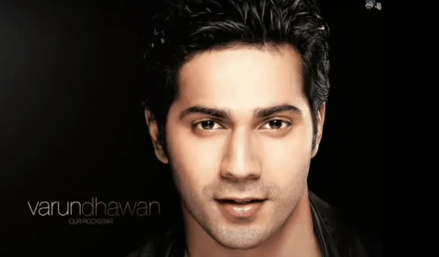 Smiling Varun Dhawan in black shirt showing his short hairstyles - Varun Dhawan new hairstyle