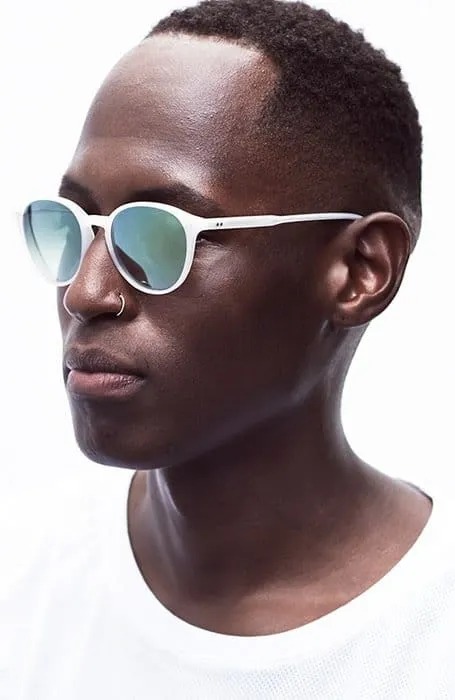 A man in white t-shirt and goggles showing his Short Afro hairstyle - short hairstyle for men