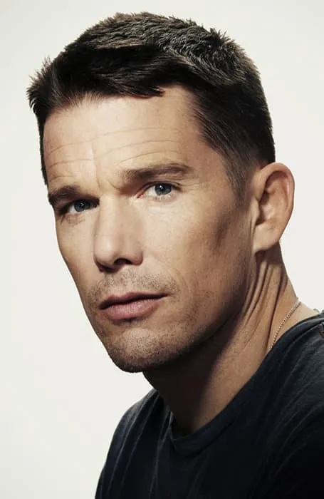 A man in black t-shirt showing his Butch Cut - hairstyle for men