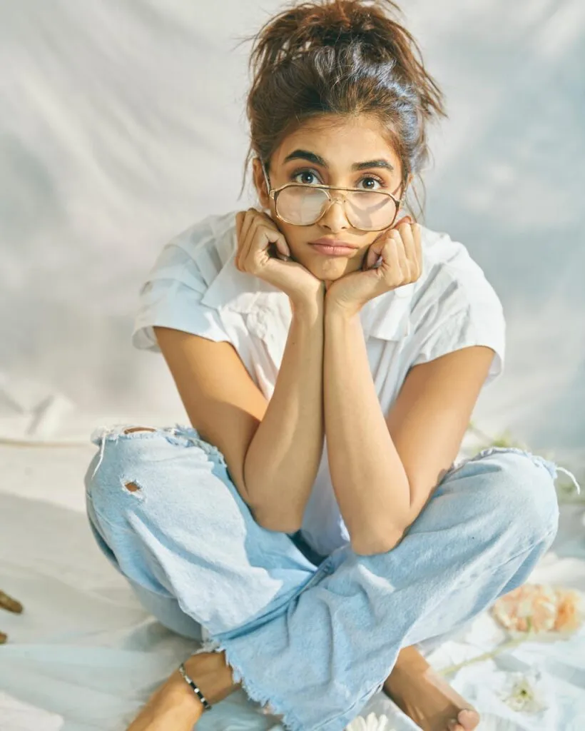 Pooja Hegde in white shirt blue jeans with spectacles posing for a no makeup look Pooja Hegde in white shirt blue jeans with spectacles posing for a no makeup look - south actress without makeup