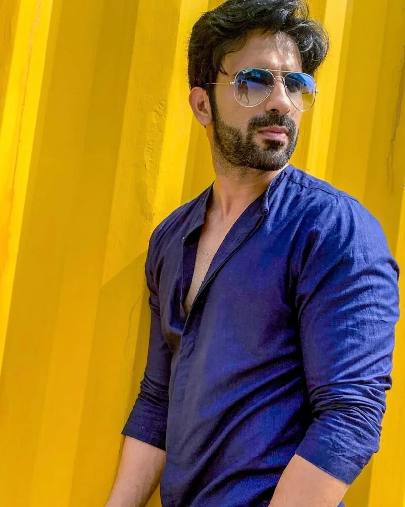 Ankit Siwach in blue shirt with goggles posing for camera Ankit Siwach in blue shirt with goggles posing for camera - most handsome tv actors indian 2022