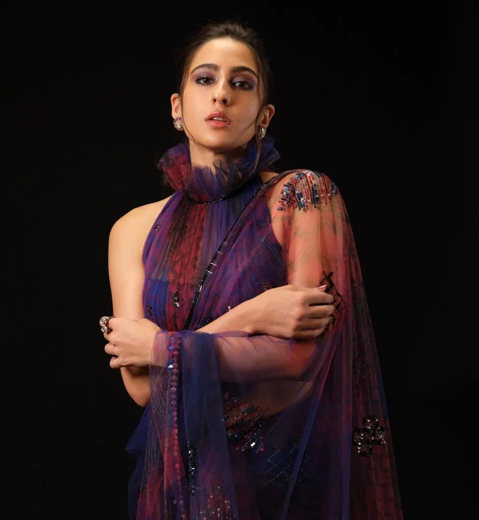 Sara Ali Khan in multicolor net saree with high neck blouse posing for camera - haircut bollywood