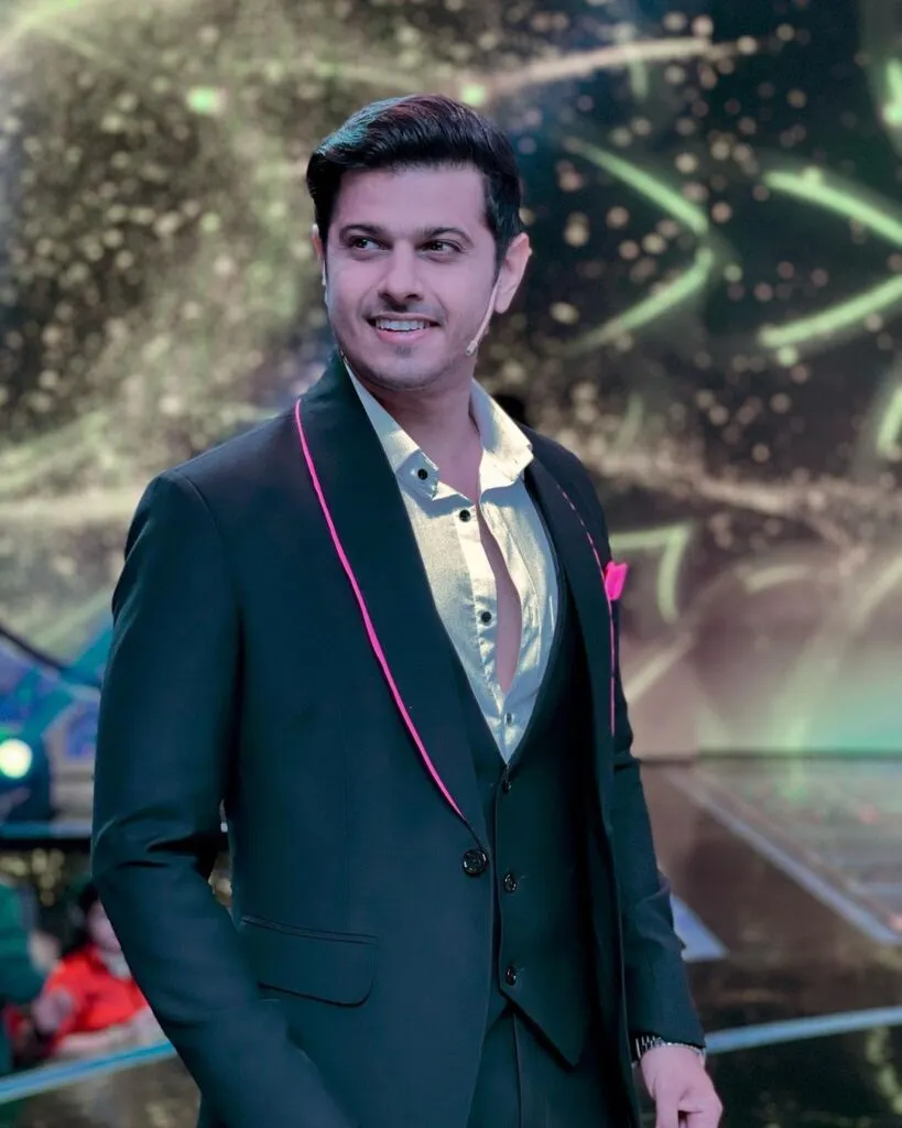 Smiling Neil Bhatt in blue suit with white front open shirt posing for camera Smiling Neil Bhatt in blue suit with white front open shirt posing for camera - most handsome tv actor
