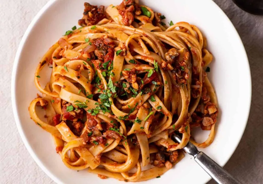 Italian-Style Spaghetti Squash with Tempeh served in a white plate - high protein vegetarian recipes indian