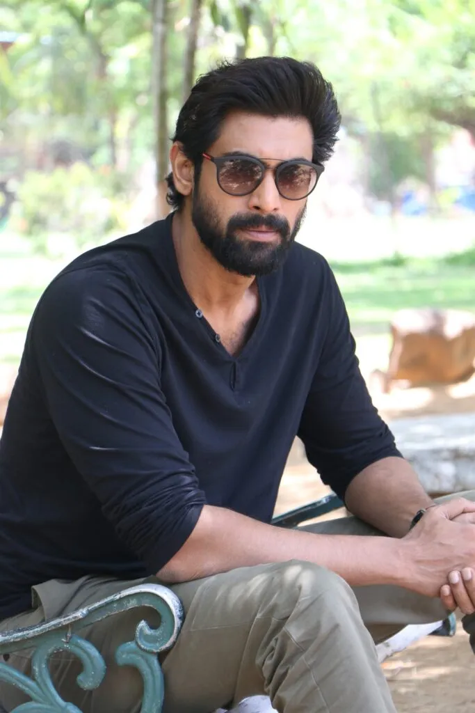 Rana Daggubati in blue full sleeves t-shirt with grey trouser and goggles siting on a bench Rana Daggubati in blue full sleeves t-shirt with grey trouser and goggles siting on a bench - indian celebrities with diabetes type 2