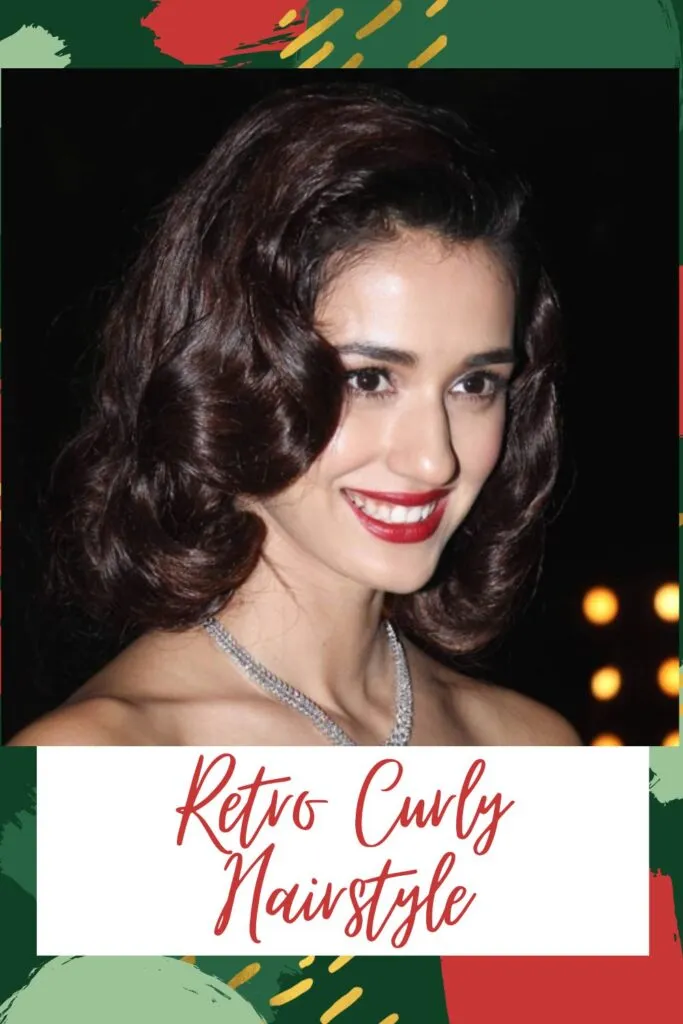 Smiling girl in off shoulder dress with diamond necklace and red lipstick posing for camera and showing her retro curly hairstyle Smiling girl in off shoulder dress with diamond necklace and red lipstick posing for camera and showing her retro curly hairstyle - Indian hair cut names