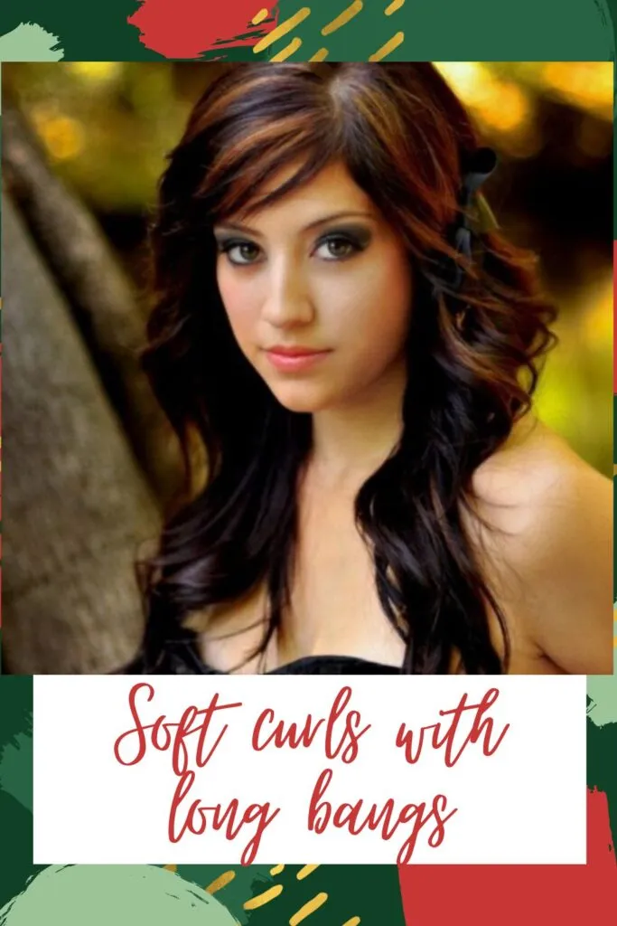 A girl in black off shoulder dress posing for camera and showing her soft curls with long bangs A girl in black off shoulder dress posing for camera and showing her soft curls with long bangs - Haircuts for Indian Women