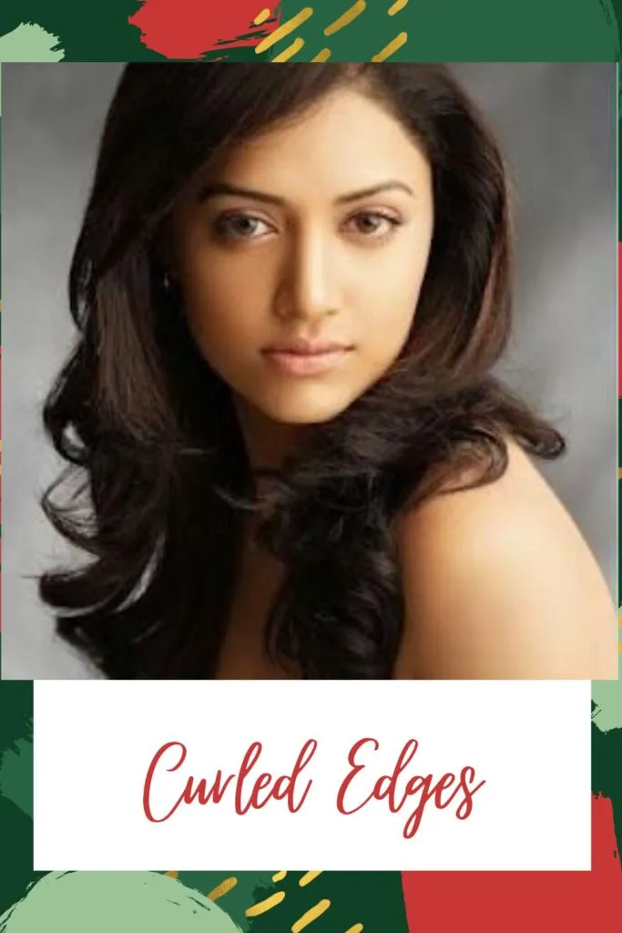 A girl in off shoulder dress posing for camera and showing her curled edges hairstyle A girl in off shoulder dress posing for camera and showing her curled edges hairstyle - Haircuts for Indian Women