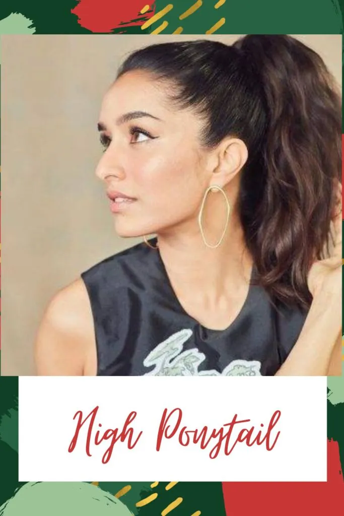 A girl in black cut sleeves top with hoops earrings posing for camera and showing the side view of her high ponytail A girl in black cut sleeves top with hoops earrings posing for camera and showing the side view of her high ponytail - Indian hair cut photos