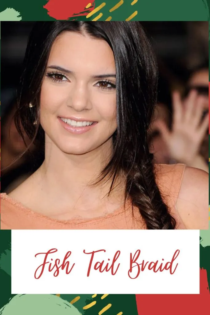 A smiling girl in orange cut sleeves top posing for camera and showing the side view of her fish tail braid A smiling girl in orange cut sleeves top posing for camera and showing the side view of her fish tail braid - Indian hair cut names