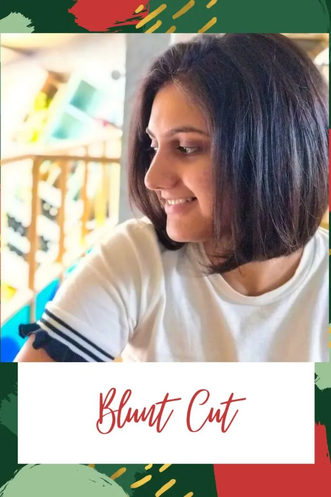 A smiling girl in white t-shirt showing the side view of her blunt cut A smiling girl in white t-shirt showing the side view of her blunt cut - Short hairstyles for Indian women