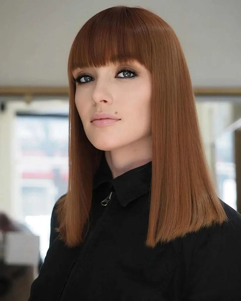 Woman in black shirt and Long Top Edges hairstyle Woman in black shirt and Long Top Edges hairstyle - easy hairstyles for straight long hair