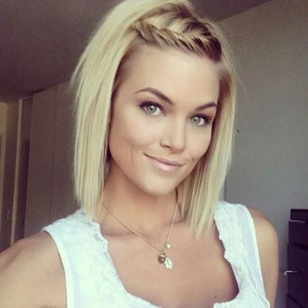 A smiling women in white cut sleeves dress and Straight Twist hairstyle A smiling women in white cut sleeves dress and Straight Twist hairstyle - haircuts for long straight hair