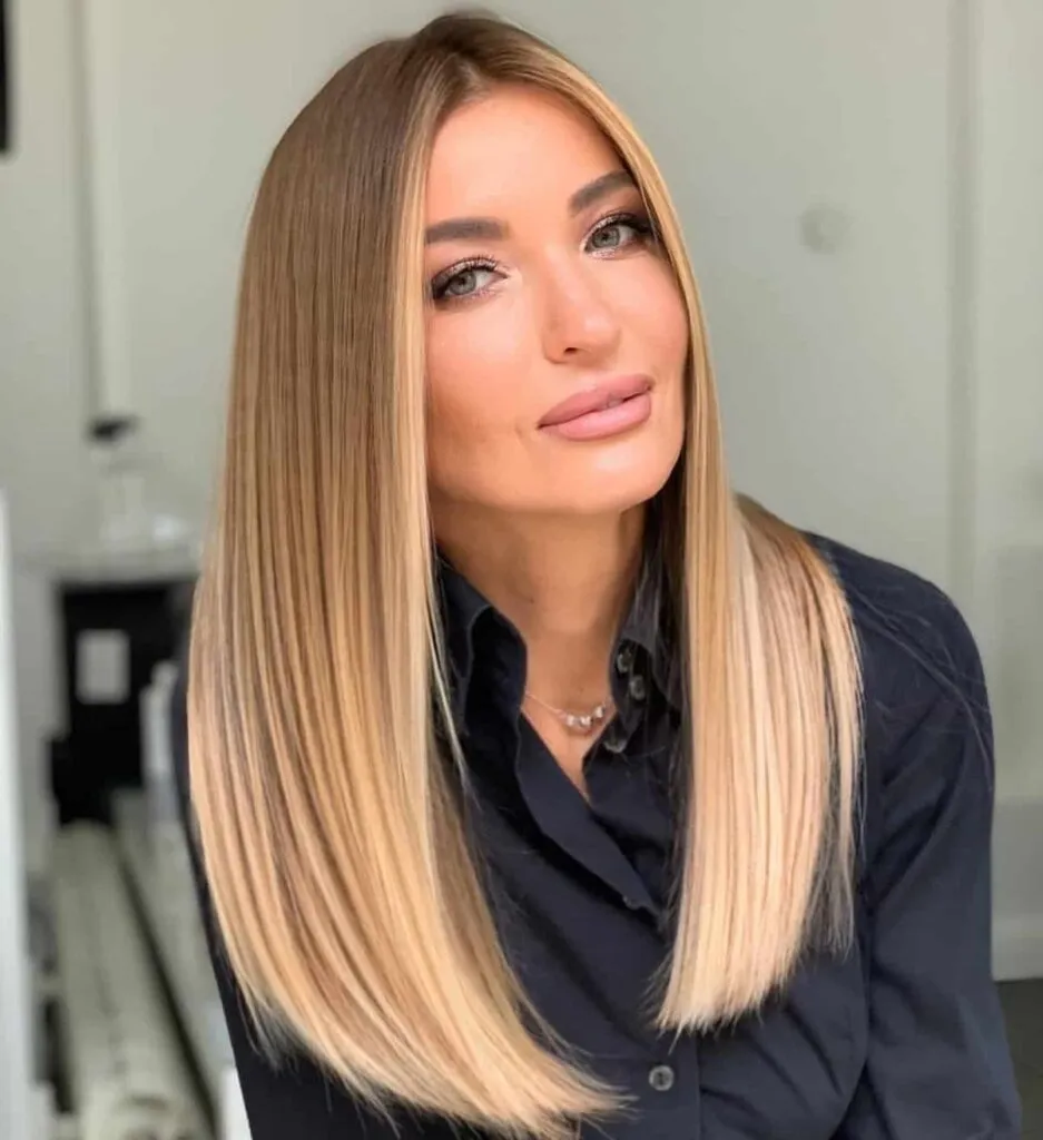 Woman in black shirt and Long and sleek hairstyle - hairstyle for girls