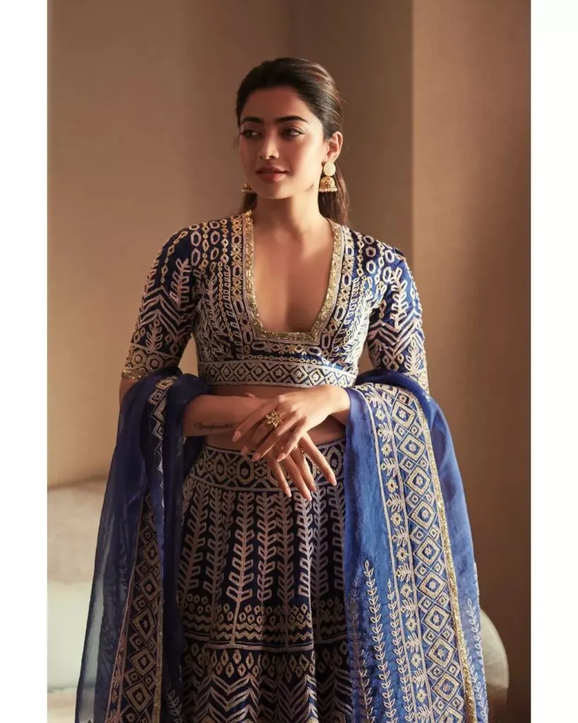 Rashmika Mandana in blue and golden lehenga and half tie hair Rashmika Mandana in blue and golden lehenga and half tie hair - bollywood actress latest hairstyles