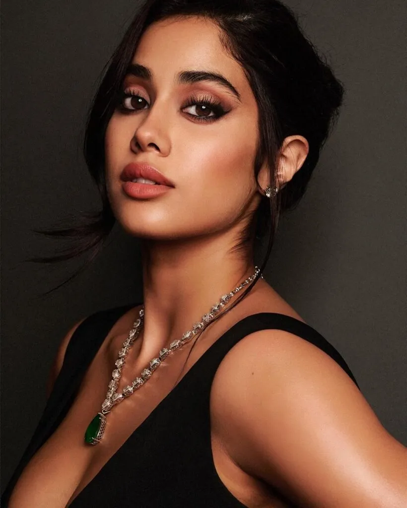 Janhvi Kapoor in black deep neck cut sleeves top and bun hairstyle Janhvi Kapoor in black deep neck cut sleeves top and bun hairstyle - bollywood actresses haircut