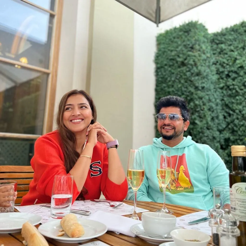 Suresh Raina and Priyanka Chaudhary Raina sitting and having breakfast Suresh Raina and Priyanka Chaudhary Raina sitting and having breakfast - indian cricketers wife photos