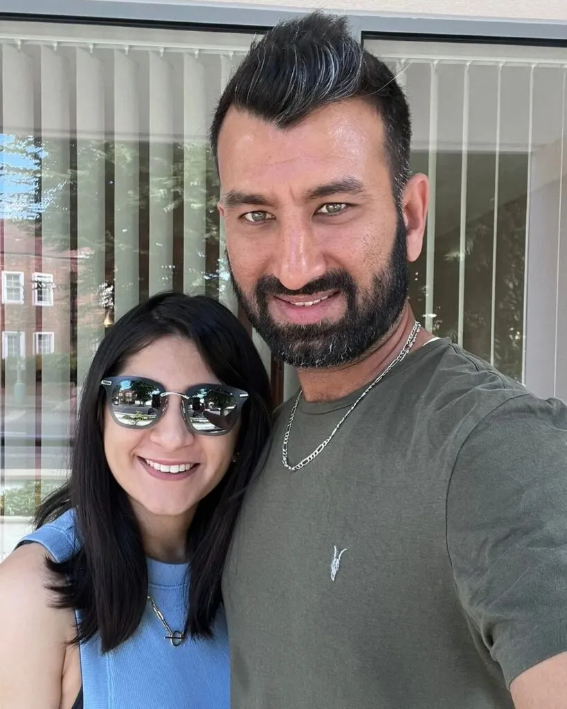 Cheteshwar Pujara and Puja Pabari posing for a selfie Cheteshwar Pujara and Puja Pabari posing for a selfie - indian cricketers and their wives