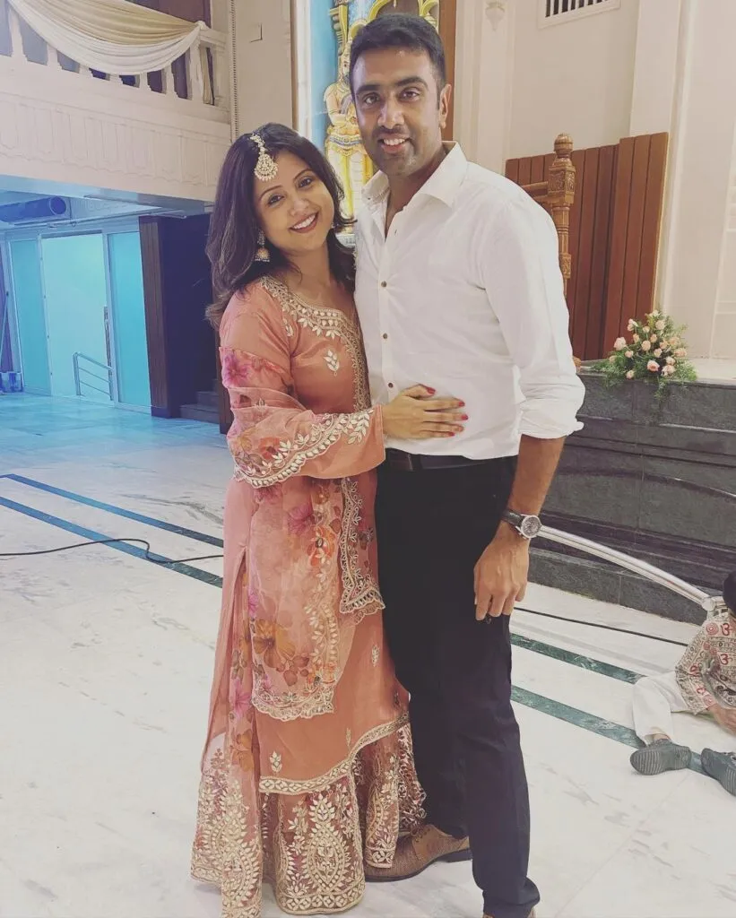 Ravichandran Ashwin and Prithi Ashwin in traditional outfit posing for camera Ravichandran Ashwin and Prithi Ashwin in traditional outfit posing for camera - indian cricketers wives and girlfriends