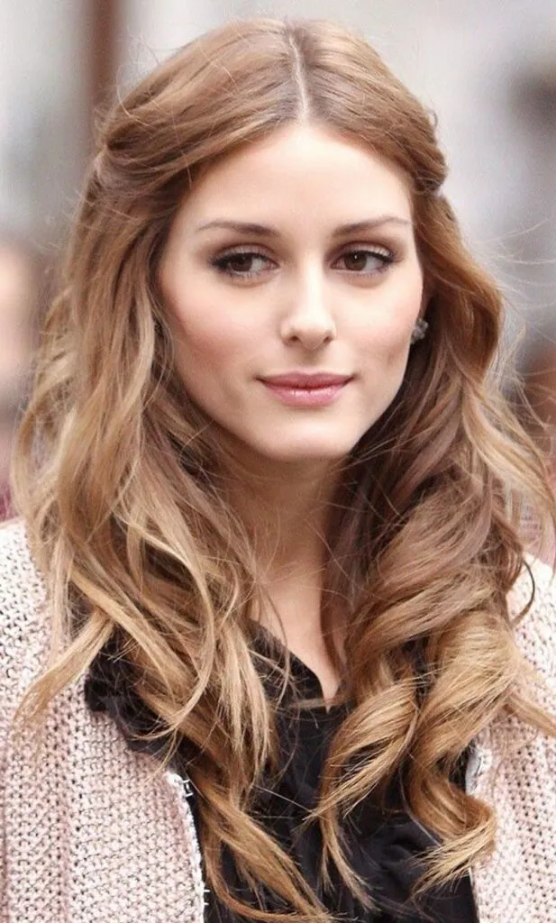 Woman in off-white sweater and black inner with Pinned Back hair - long haircut 2022 women