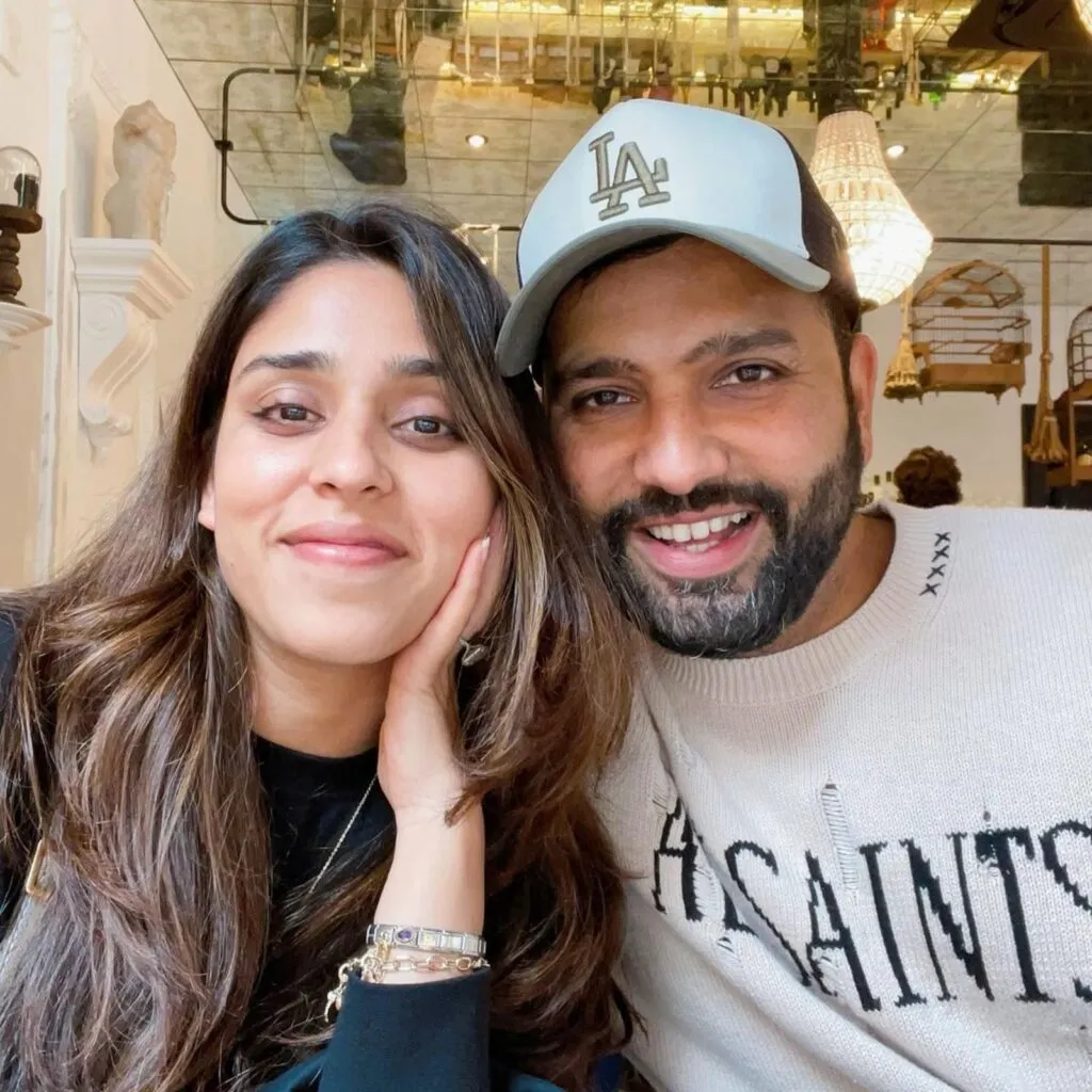 Smiling Rohit Sharma and Ritika Sajdeh posing for a selfie Smiling Rohit Sharma and Ritika Sajdeh posing for a selfie - indian cricket team and their wives