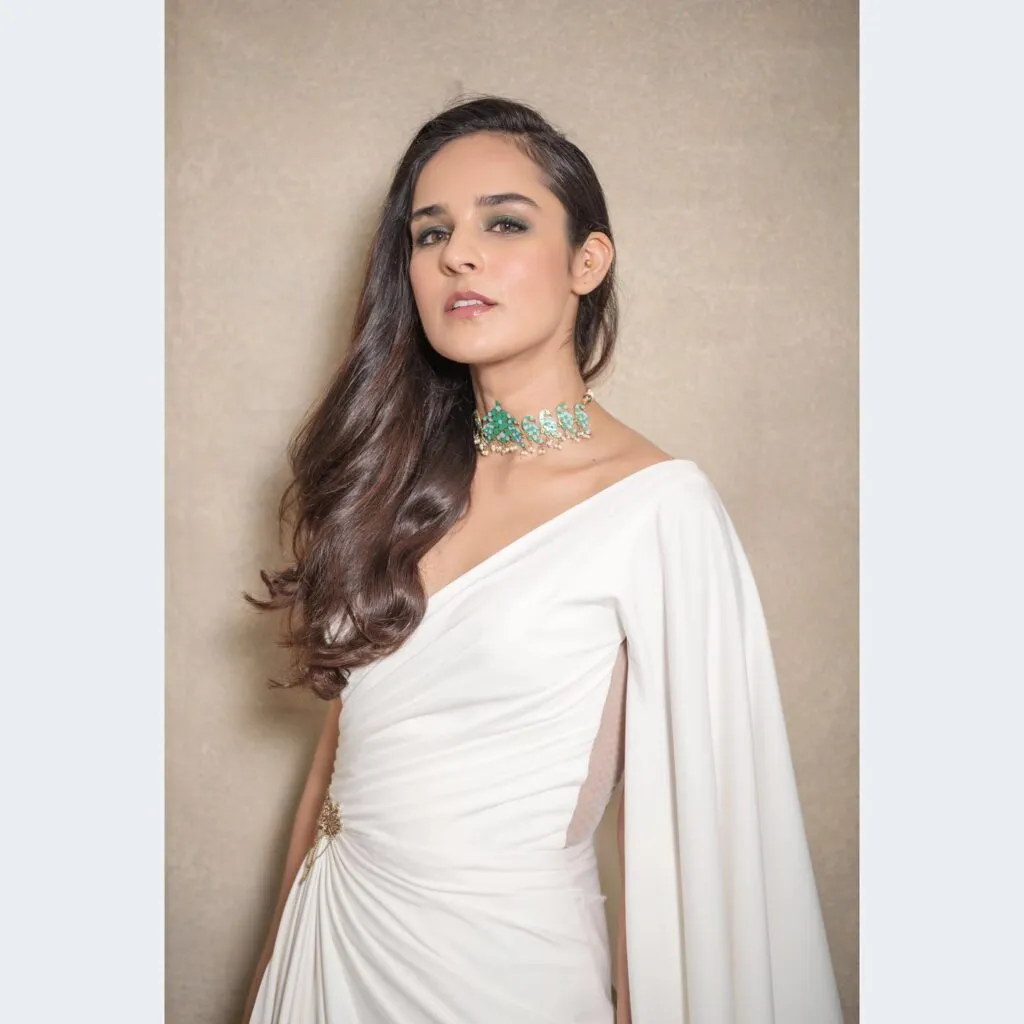 Angira Dhar in one shoulder white dress with side tuck hair Angira Dhar in one shoulder white dress with side tuck hair - bollywood actress latest hairstyles