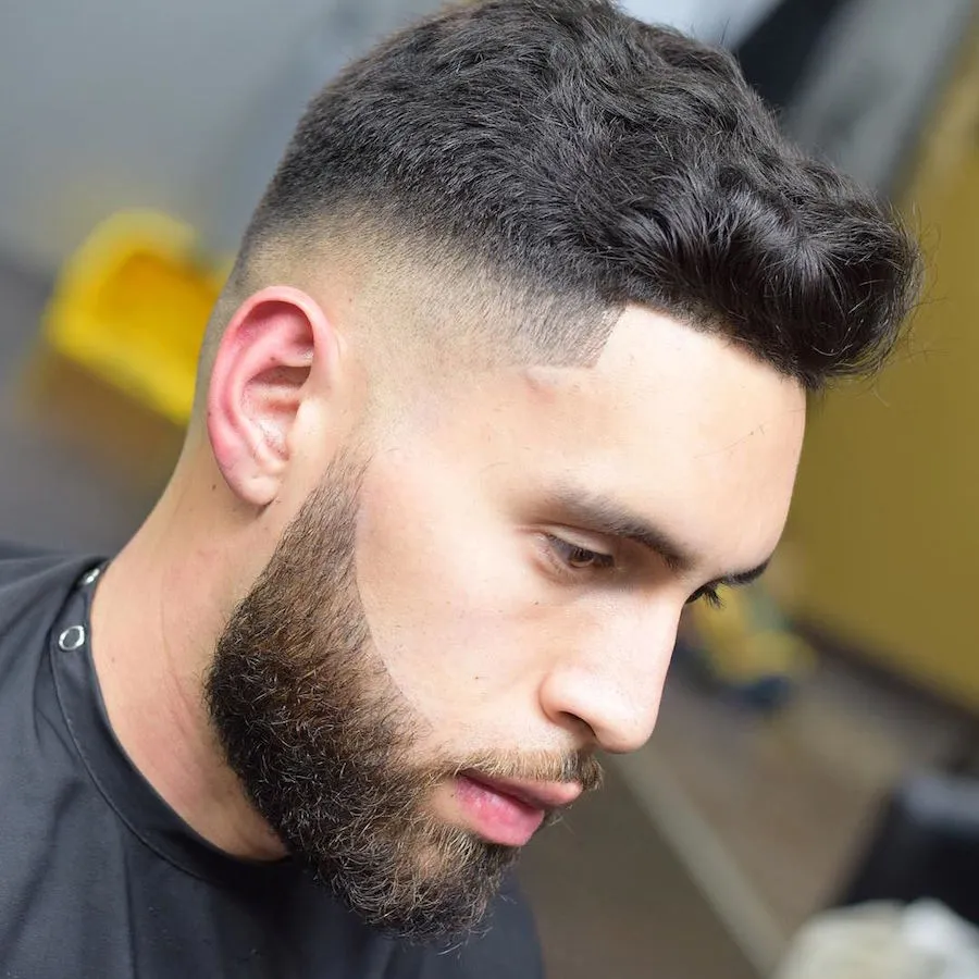 Man showing the side view of his Short Haircut For Thick Hair With Disconnected Beard hairstyle - haircuts for men fade