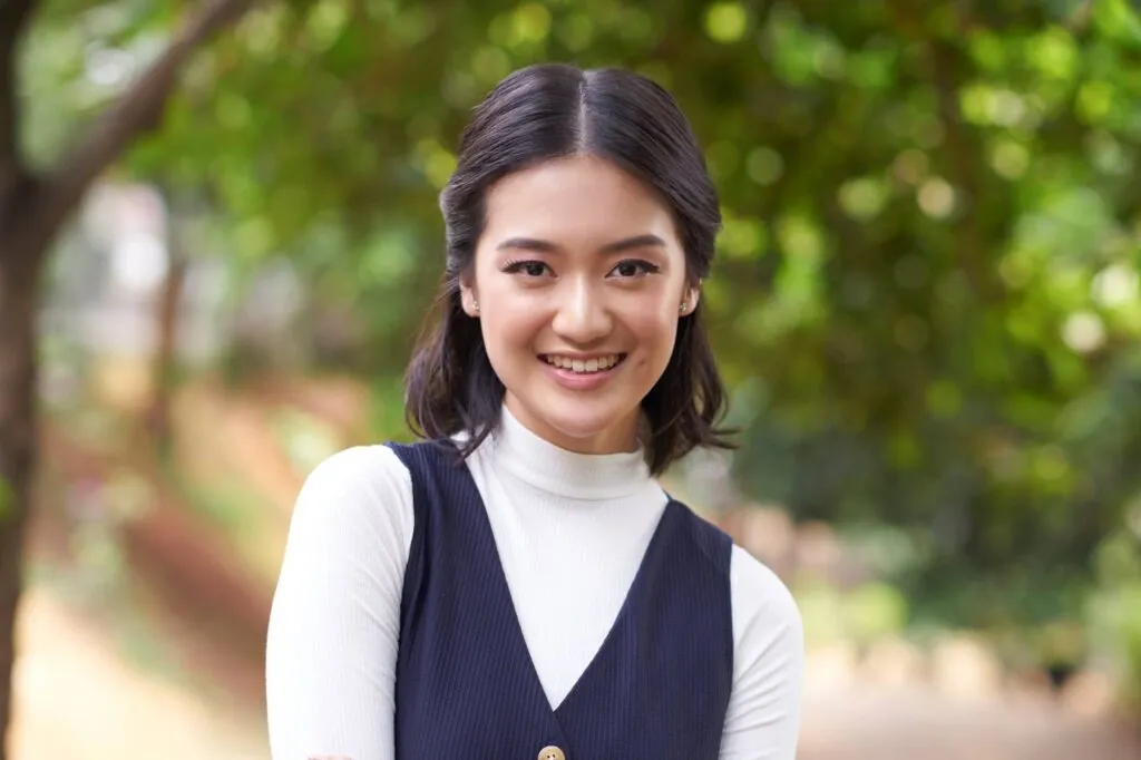 Woman in black and white dress with The half-up and half-down hairstyle - hairstyle 2022 female