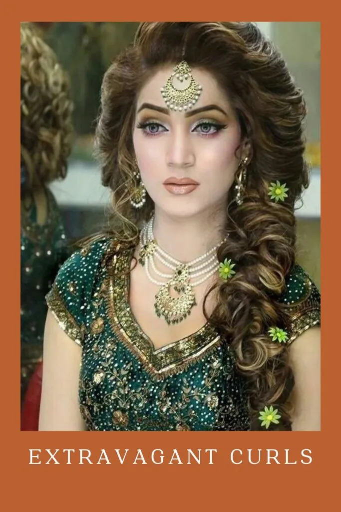 Woman in green lehenga with golden and pearl jewellery with Extravagant Curls Woman in green lehenga with golden and pearl jewellery with Extravagant Curls - curly hair for lehenga