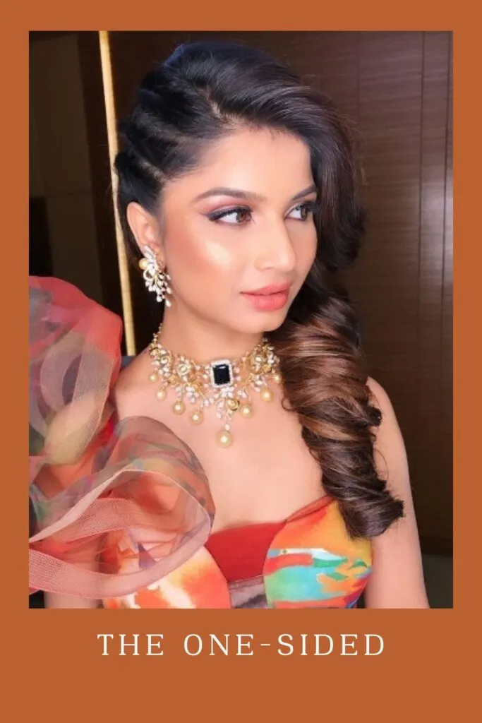 Woman in multi color dress with matching jewellery and The One-Sided hairstyle Woman in multi color dress with matching jewellery and The One-Sided hairstyle - lehenga hairstyles for curly hair