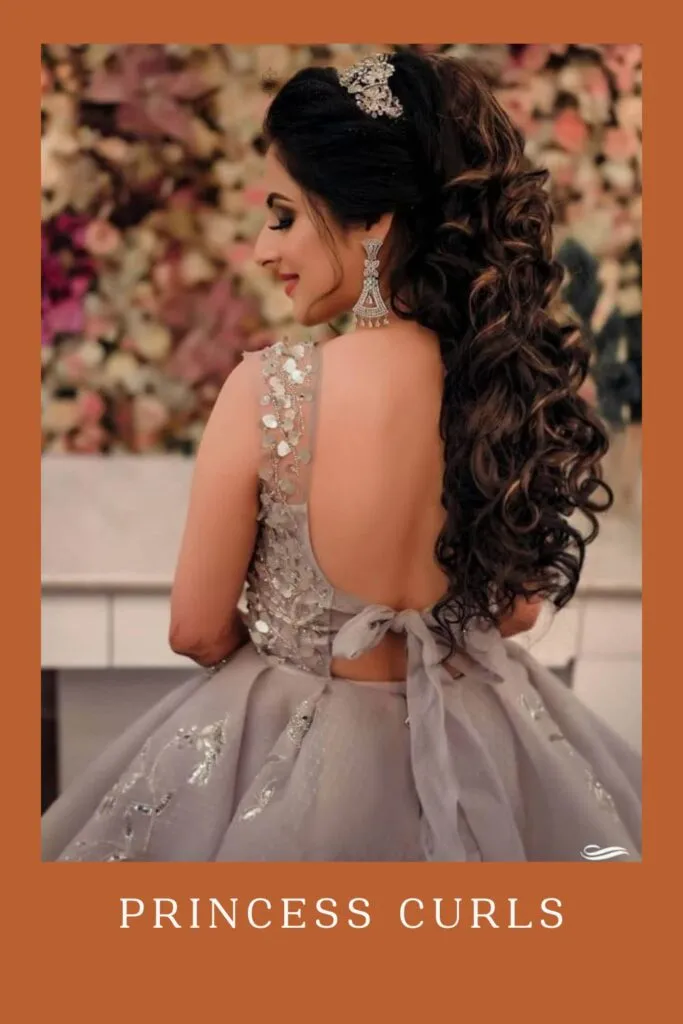 Woman in grey sequence deep neck dress and Princess Curls hairstyle Woman in grey sequence deep neck dress and Princess Curls hairstyle - open hairstyles for lehenga