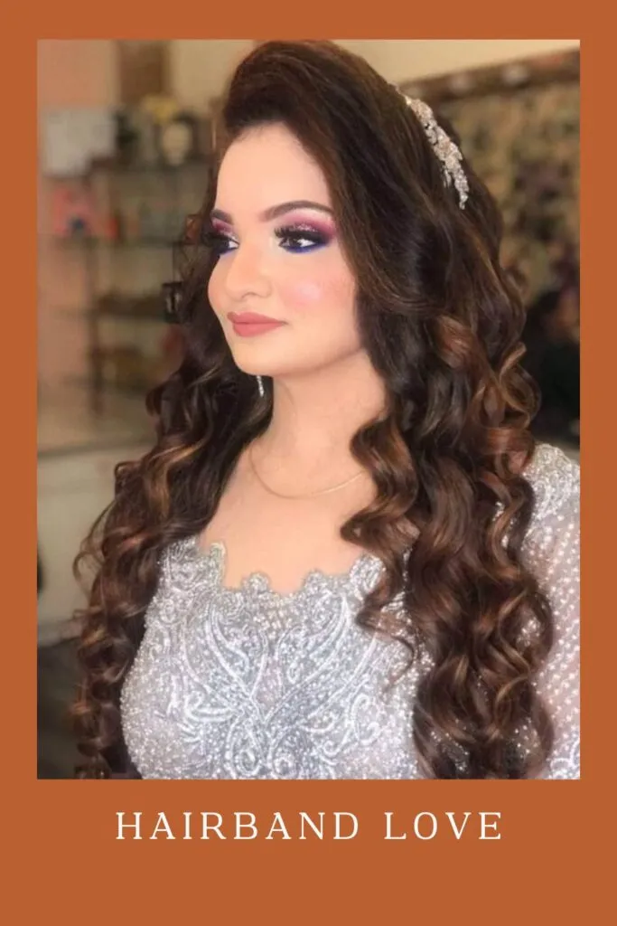 Woman in white shiny dress with Hairband Love hairstyle Woman in white shiny dress with Hairband Love hairstyle - Curly Hairstyles for lehenga