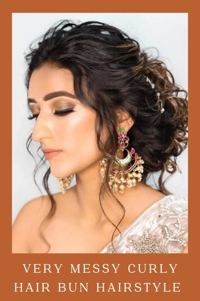 Woman in off white lehenga and multicolor danglers with Very Messy Curly Hair Bun Hairstyle Woman in off white lehenga and multicolor danglers with Very Messy Curly Hair Bun Hairstyle - open hairstyles for lehenga