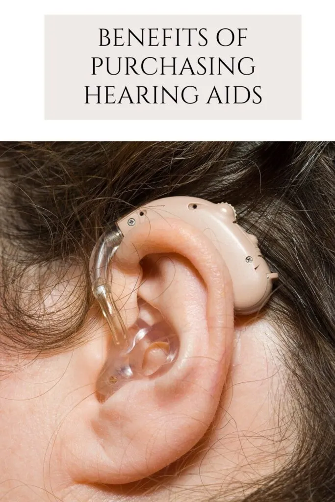 A woman is showing her hearing aid A woman is showing her hearing aid - Hearing Aids